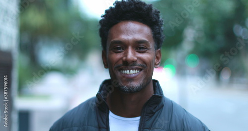 Young black African man portrait outside in city © Marco