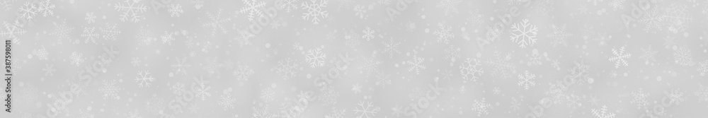 Christmas banner of snowflakes of different shapes, sizes and transparency on gray background Christmas banner of snowflakes of different shapes, sizes and transparency on gray background