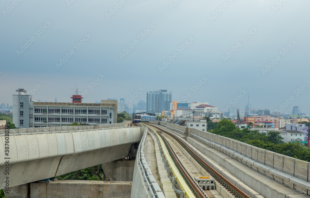 BTS Skytrain running in to the station in the evening.