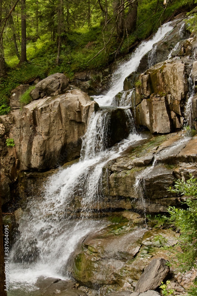 waterfall in the mountains, motion blur. waterfall in the mountains, motion blur.