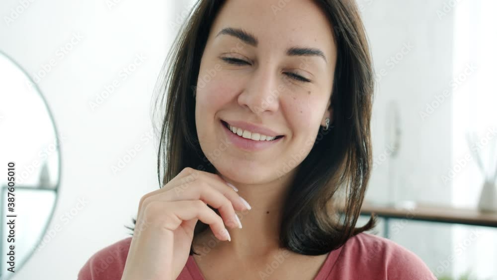 Slow motion of pretty young lady standing in bathroom alone smiling looking at camera with happy face. Positive emotions and people concept. Slow motion of pretty young lady standing in bathroom alone smiling looking at camera with happy face. Positive emotions and people concept.