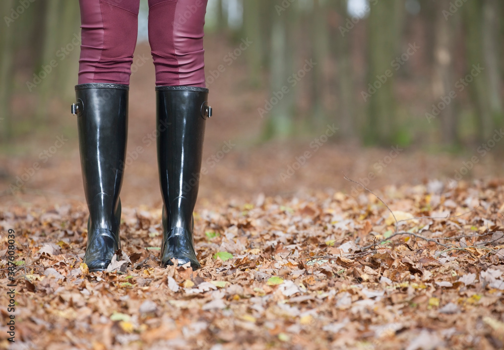 black women's boots in the autumn landscape