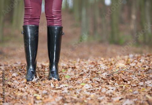 black women's boots in the autumn landscape