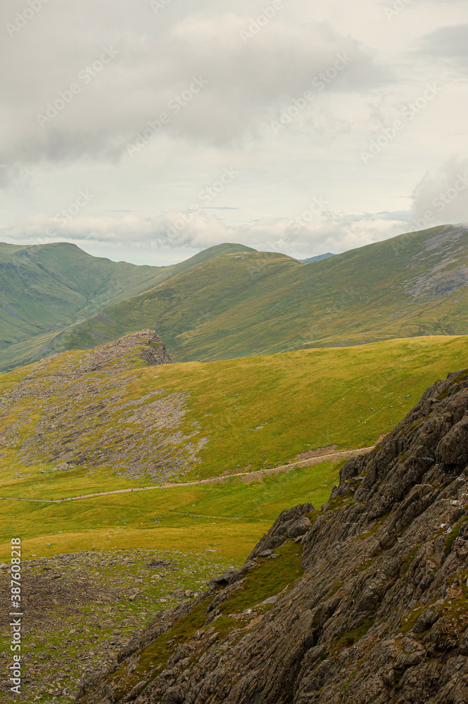 Fototapeta premium Yr Wyddfa - Snowdon mountain range with a mountain train. Snowdonia National Park. Wales. UK.