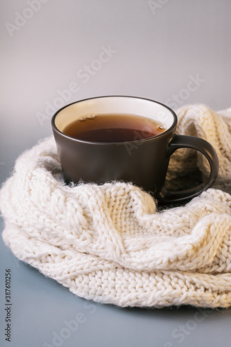 Autumn tea. Sweater, maple leaves, cookies and cup of tea with lemon.