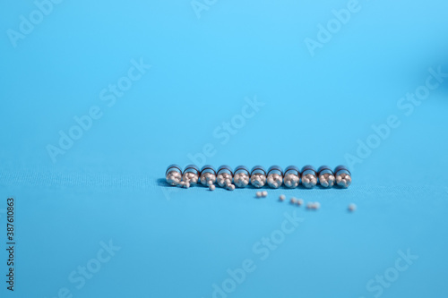 White and colored medicines in the form of figurines.