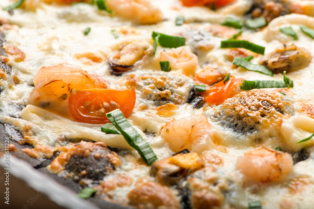 Close up view of delicious pizza on black dough with cheese mozzarella , tomatoes, seafood and green onion. Close up view of delicious pizza on black dough with cheese mozzarella , tomatoes, seafood and green onion.