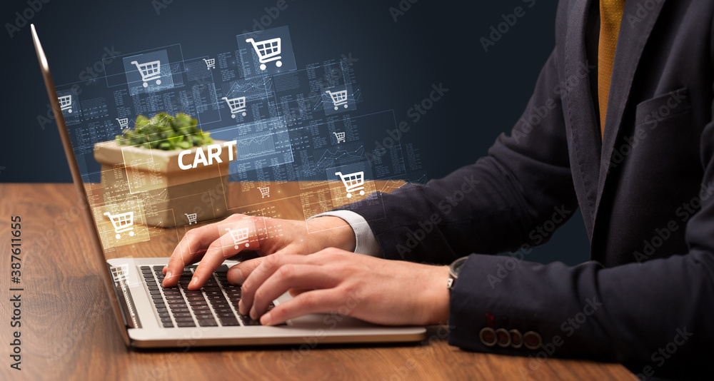 Businessman working on laptop with CART inscription, online shopping concept Businessman working on laptop with CART inscription, online shopping concept