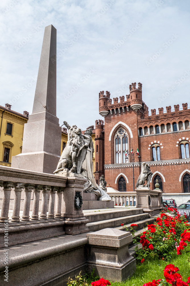 Roma square in Asti with a beautiful palace and an obelisk