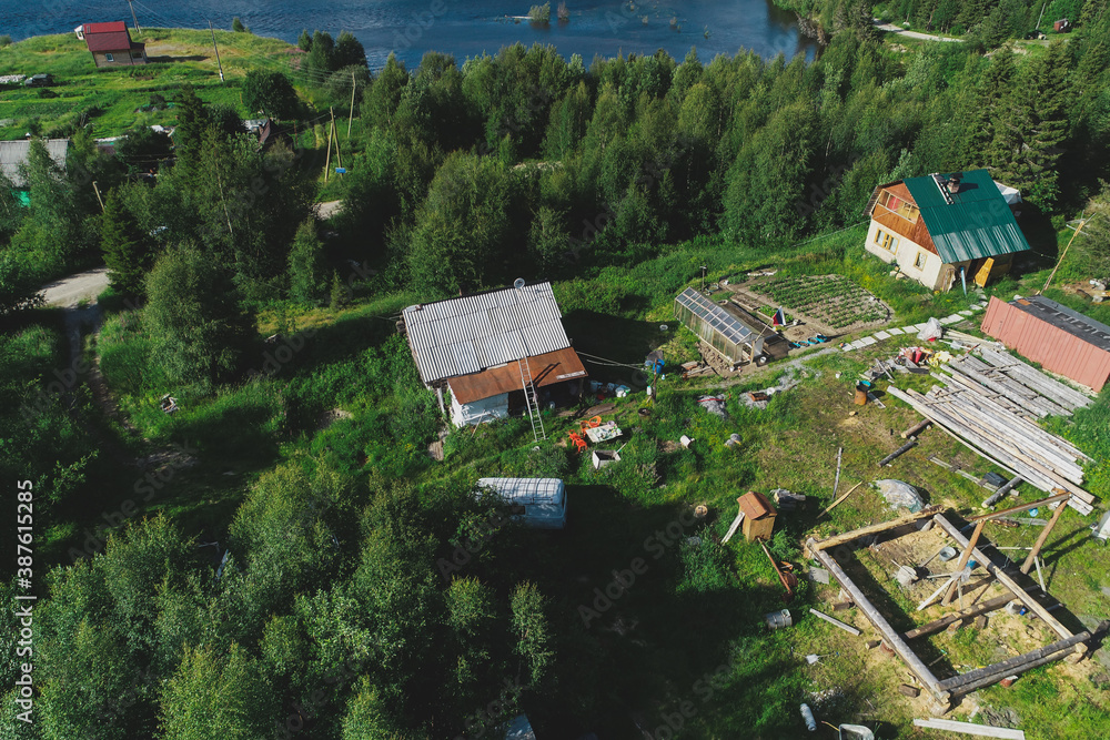 Naklejka premium Aerial Townscape of Suburban Village Kolvica located in Northwestern Russia on the Kola Peninsula Kandalaksha Area