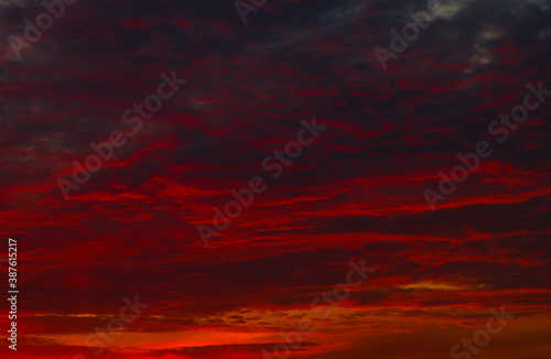 Photography Red clouds in the sunset sky (background)