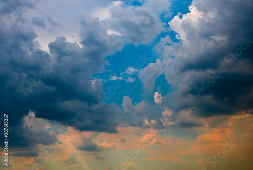 Orange and black clouds in the sunset sky