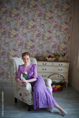 beautiful red-haired girl in vintage dress