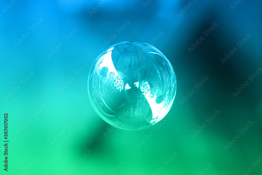 1 soap bubble on a green and blue background 1 soap bubble on a green and blue background