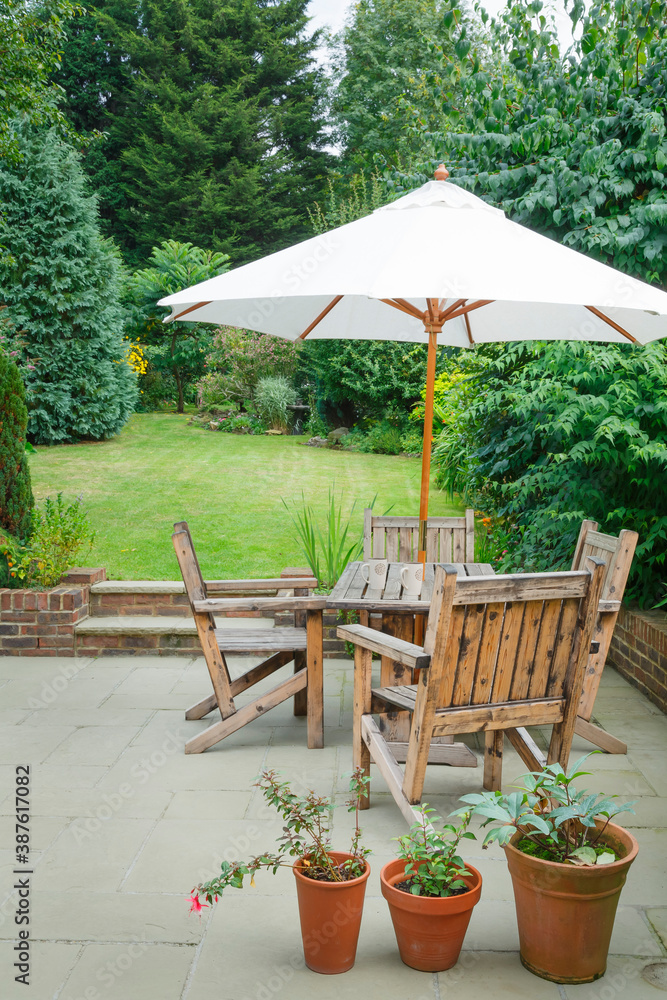 Fototapeta UK back garden patio with garden furniture