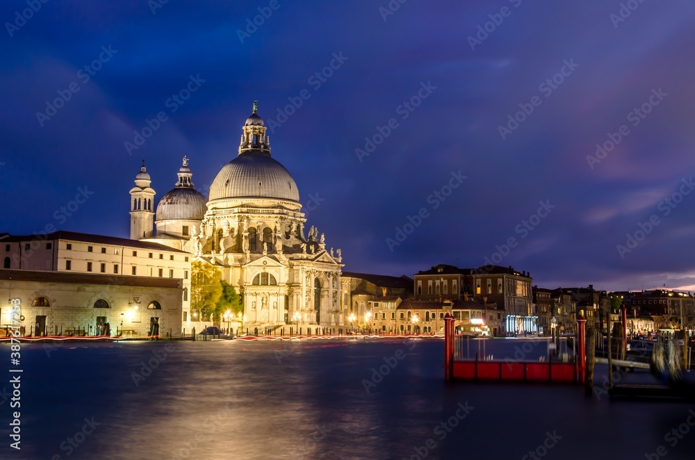 The Basilica of St Mary of Health or Basilica di Santa Maria della Salute at grand canal at night in Venice, Italy