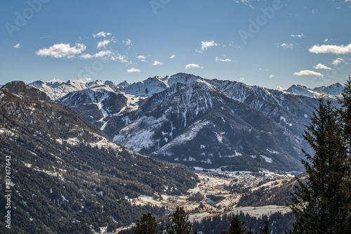 View over the Fassa Valley in the Dolomites from the Rosengarten ski area with the village of Soraga di Fassa photo