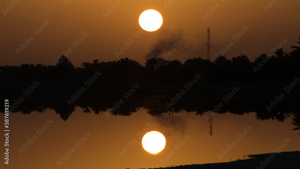 Fototapeta premium sunset over the river