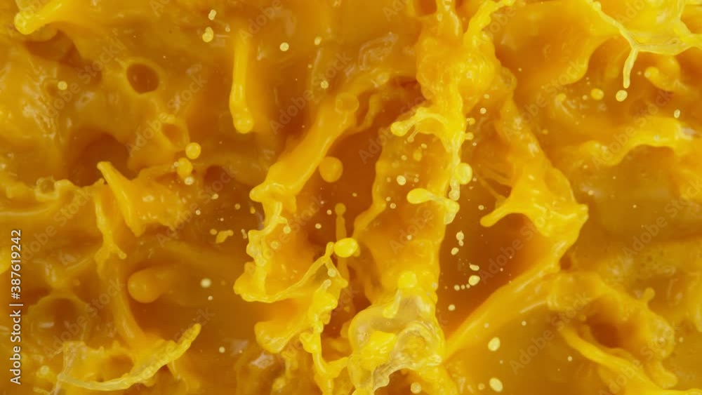 Super slow motion of splashing orange juice. Filmed on high speed cinema camera, 1000 fps. Super slow motion of splashing orange juice. Filmed on high speed cinema camera, 1000 fps.