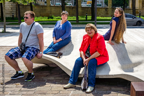 A group of Mature tourists walk through the streets