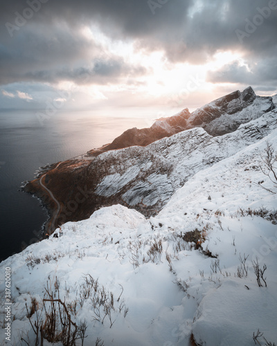 A sunset over the snowy mountains in Lofoten
