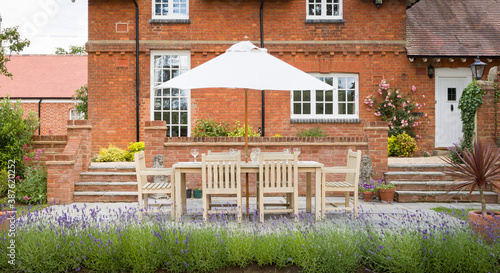 Bilde på lerret House and garden furniture on a patio in UK back garden