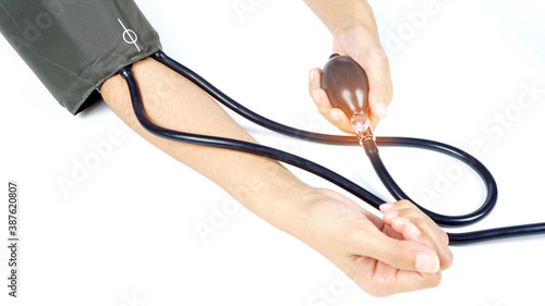 A woman checks blood pressure by herself, chooses focus. © surasak