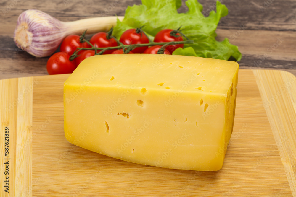 Hard yellow tasty cheese brick Hard yellow tasty cheese brick