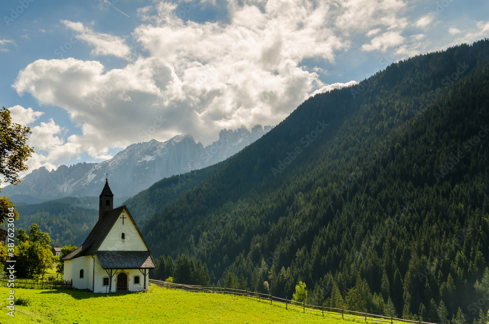 Fototapeta premium Beautiful view of church and famous dolomite mountain, Italy.