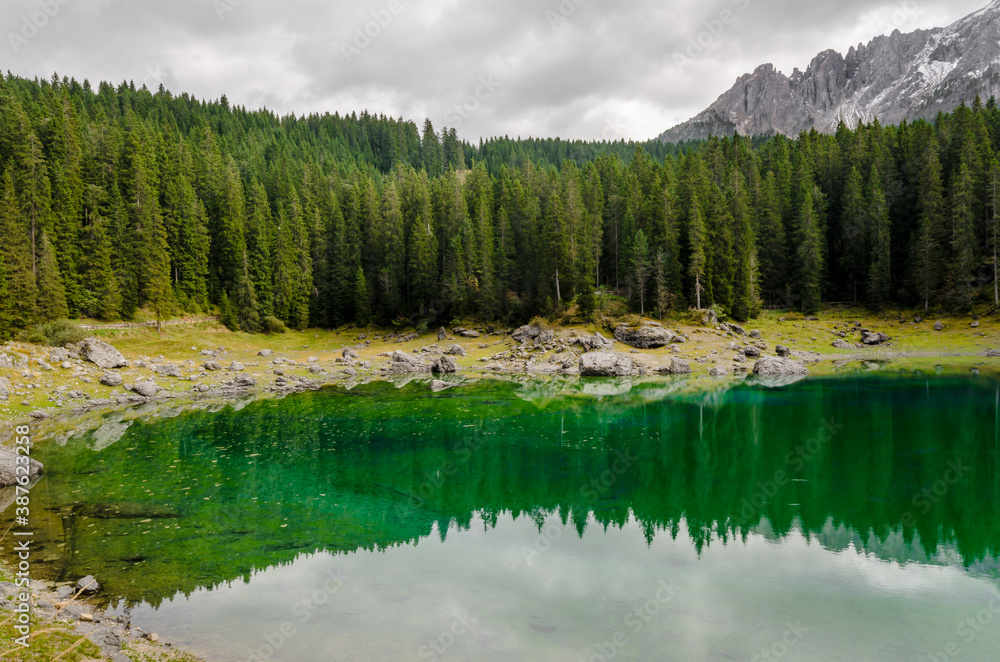 Beautiful view of famous Carezza lake at dolomite mountain, Italy.