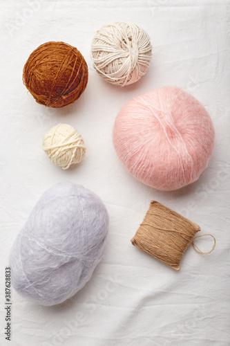 Balls of wool and mohair for knitting in pastel colors
