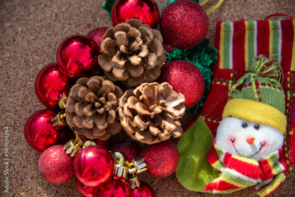 Christmas decorations and cones on a natural wooden background
