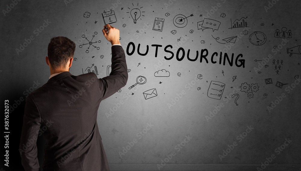 businessman drawing a creative idea sketch with OUTSOURCING inscription, business strategy concept businessman drawing a creative idea sketch with OUTSOURCING inscription, business strategy concept
