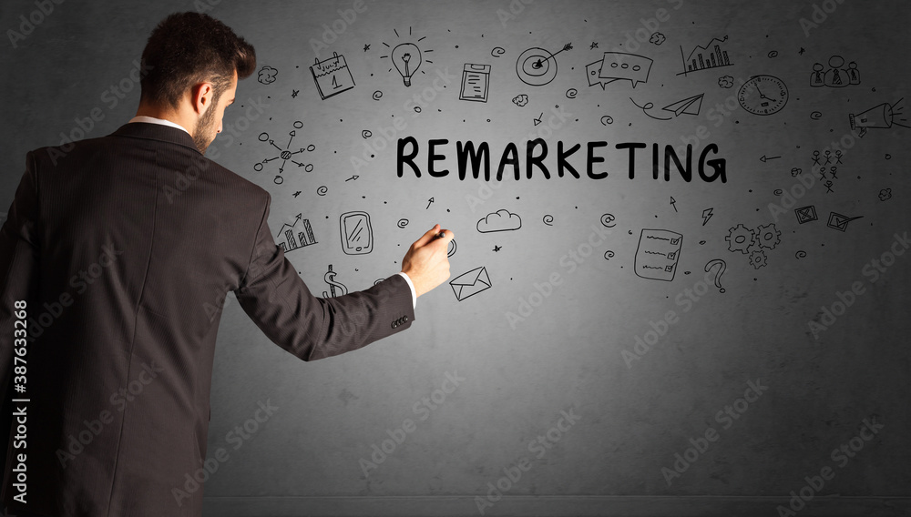 businessman drawing a creative idea sketch with REMARKETING inscription, business strategy concept businessman drawing a creative idea sketch with REMARKETING inscription, business strategy concept
