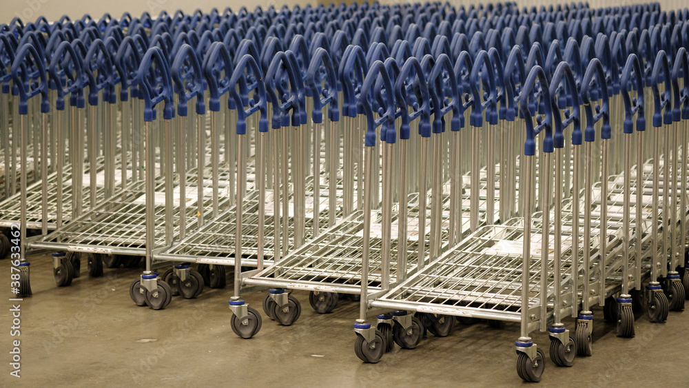 IKEA shopping carts lined up in rows in trolleys area of IKEA Store