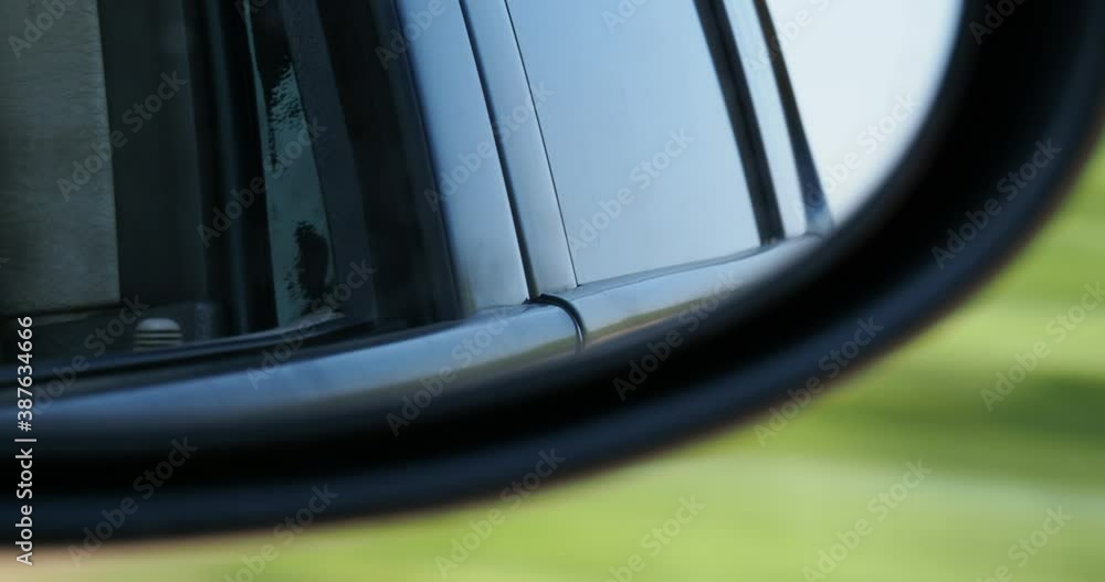 Traveling in August leaving the city towards a forest. The view of the green trees of a forest through a car window. Traveling in August leaving the city towards a forest. The view of the green trees of a forest through a car window.
