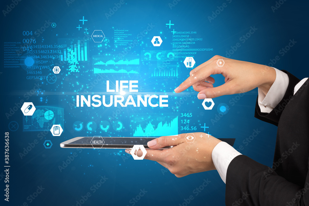 Close-up of a touchscreen with LIFE INSURANCE inscription, medical concept Close-up of a touchscreen with LIFE INSURANCE inscription, medical concept