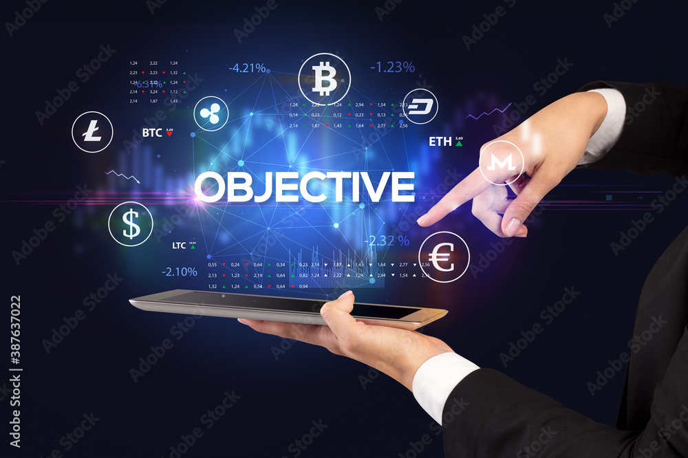 Fototapeta premium Close-up of a touchscreen with OBJECTIVE inscription, business opportunity concept