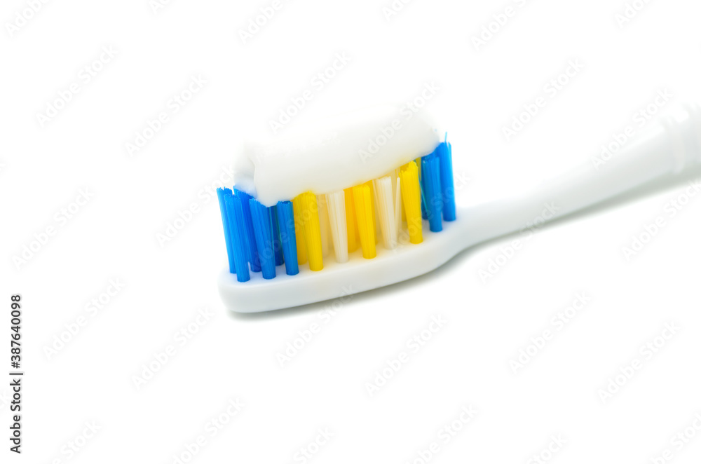 Toothbrush with colored bristles on a white background Toothbrush with colored bristles on a white background