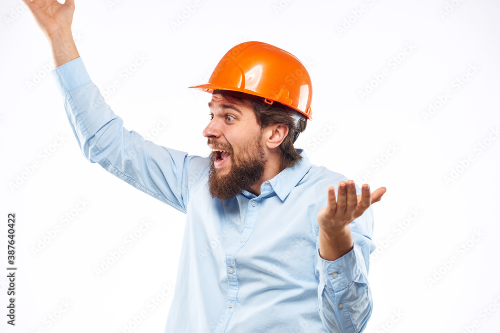 man in work uniform orange helmet professional safety industry construction