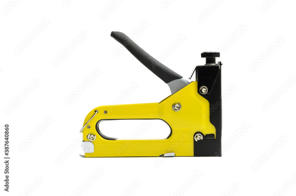 industrial stapler for driving staples on a white background industrial stapler for driving staples on a white background