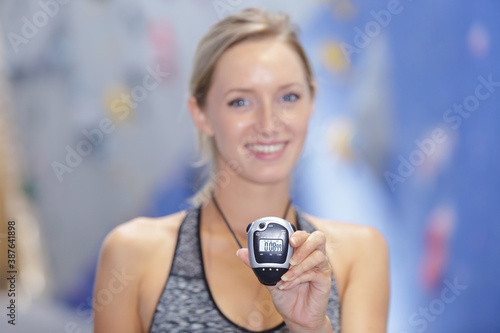 female trainer holding a chronometer