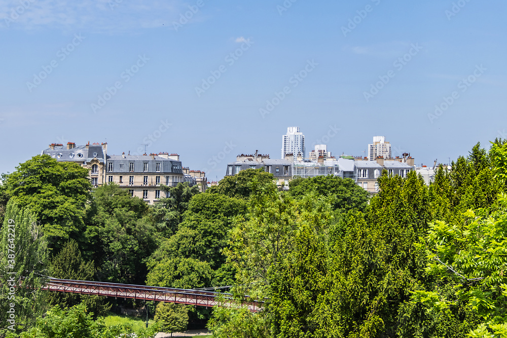 Fototapeta premium Buttes-Chaumont Park (Parc des Buttes-Chaumont, 1867) - Public Park situated in northeastern Paris. Buttes-Chaumont Park - fifth-largest park in Paris. France.