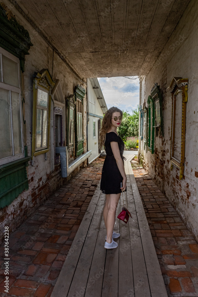 Russia, Yuryev-Polsky. Beautiful girl tourist visits the sights. Russia, Yuryev-Polsky. Beautiful girl tourist visits the sights.