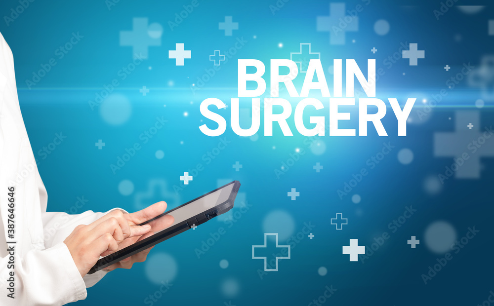 doctor writes notes on the clipboard with BRAIN SURGERY inscription, first aid concept doctor writes notes on the clipboard with BRAIN SURGERY inscription, first aid concept