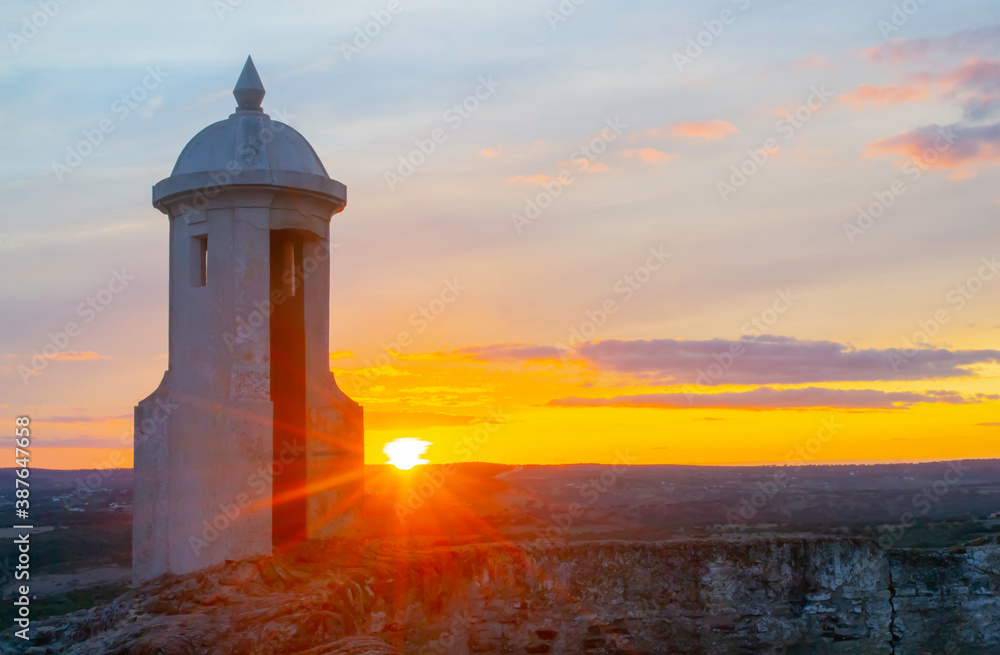 Sunset on the background of the fort's observation tower