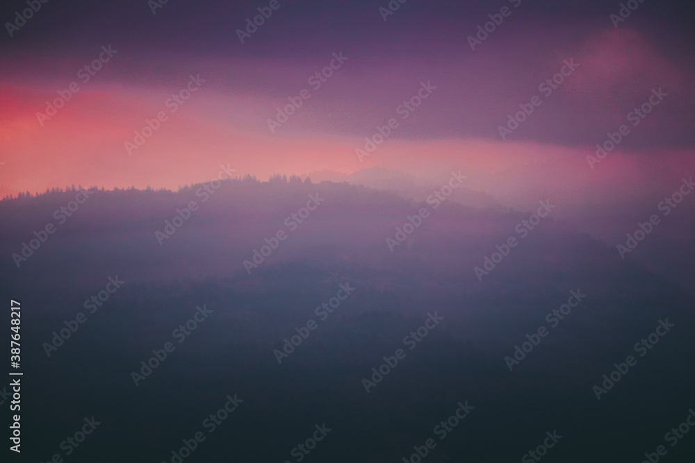Sunrise over mountains and forest in Slovenia in Triglav national park