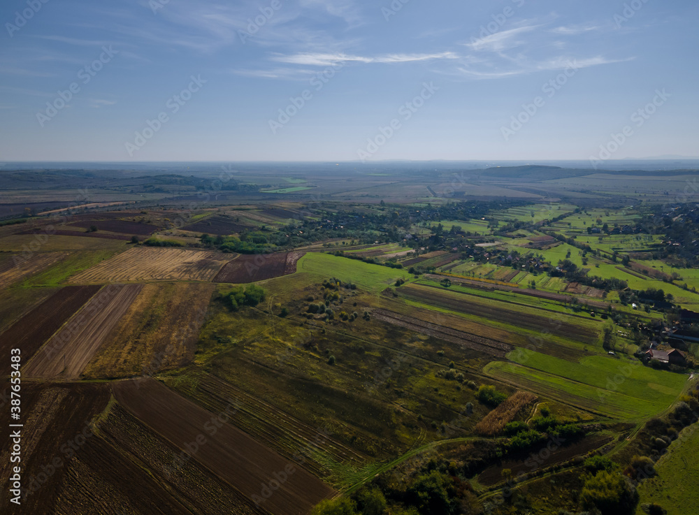 Green of agricultural fields aerial view with roads farmland of the countryside
