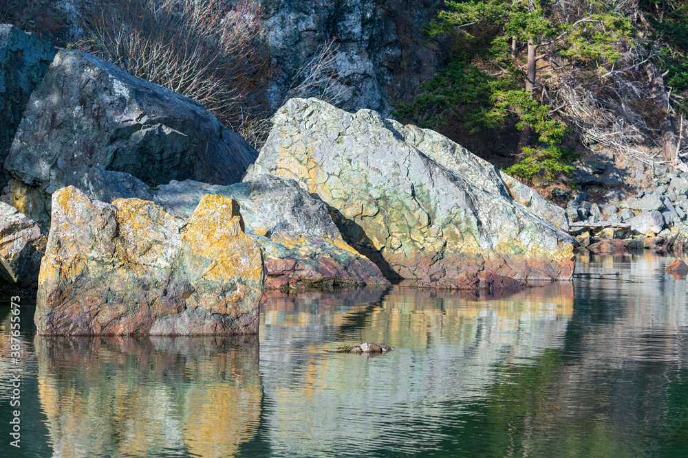 Rock formations in water at Watmough Bay, Lopez Island, Washington, USA