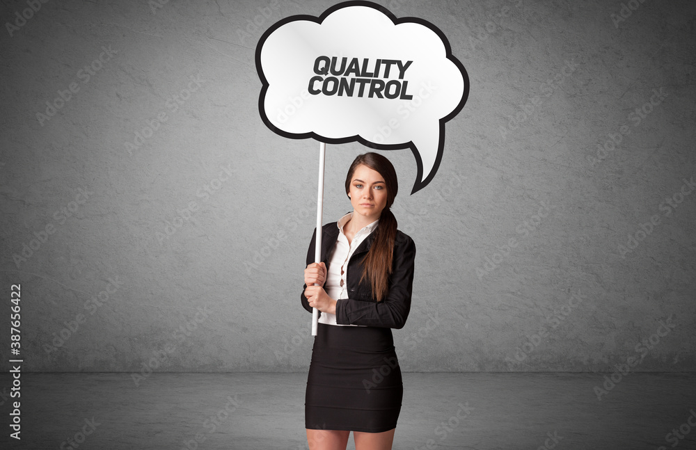 Young business person in casual holding road sign with QUALITY CONTROL inscription, new business idea concept Young business person in casual holding road sign with QUALITY CONTROL inscription, new business idea concept